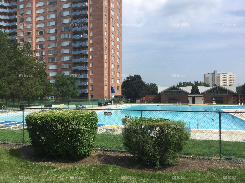 Swimming pool with high rise apartment 