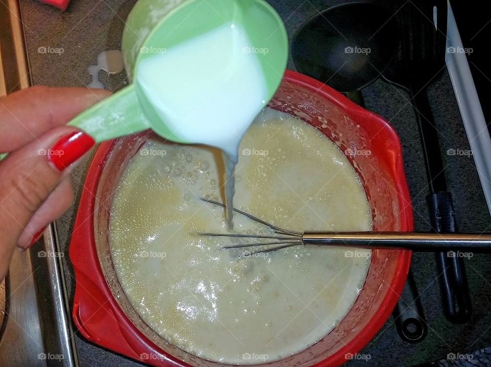 Make the batter for pancakes.