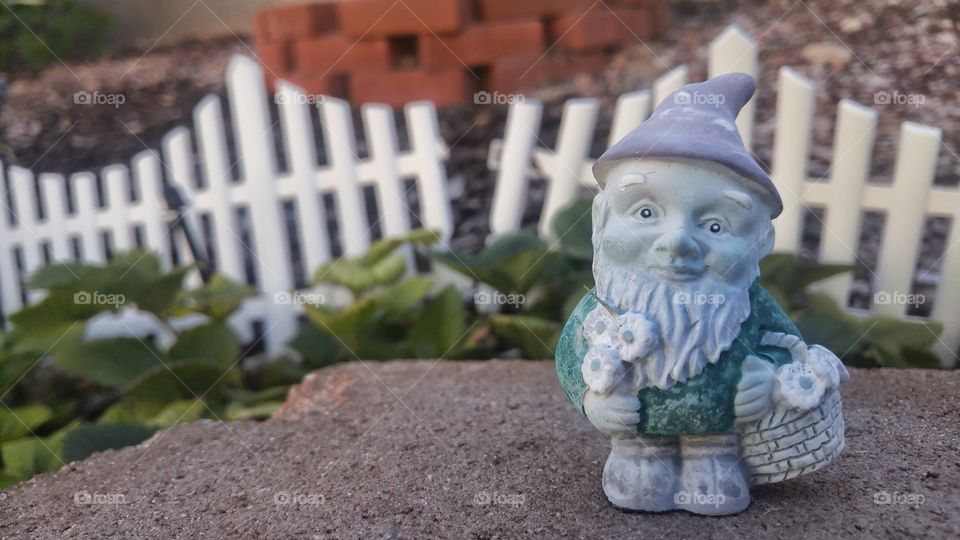 faded lonely garden gnome