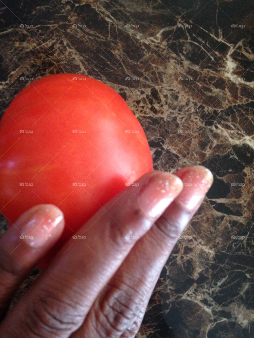 Holding tomato 