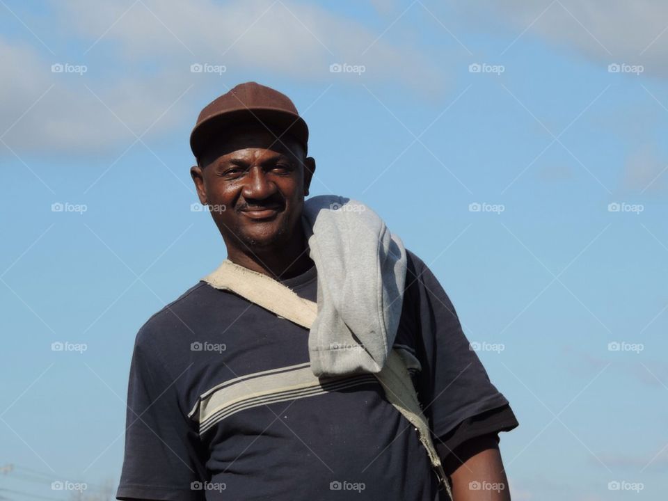 migrant worker sling hat man by 5hels
