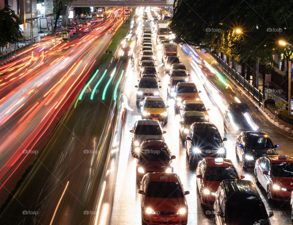 Beautiful Lighting of Vehicle head lamp and rear lamp in front of the most famous shopping center MBK, Bangkok Thailand