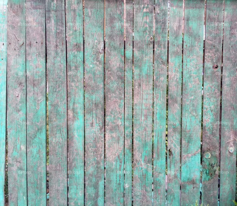 Texture and colors of a wooden fence