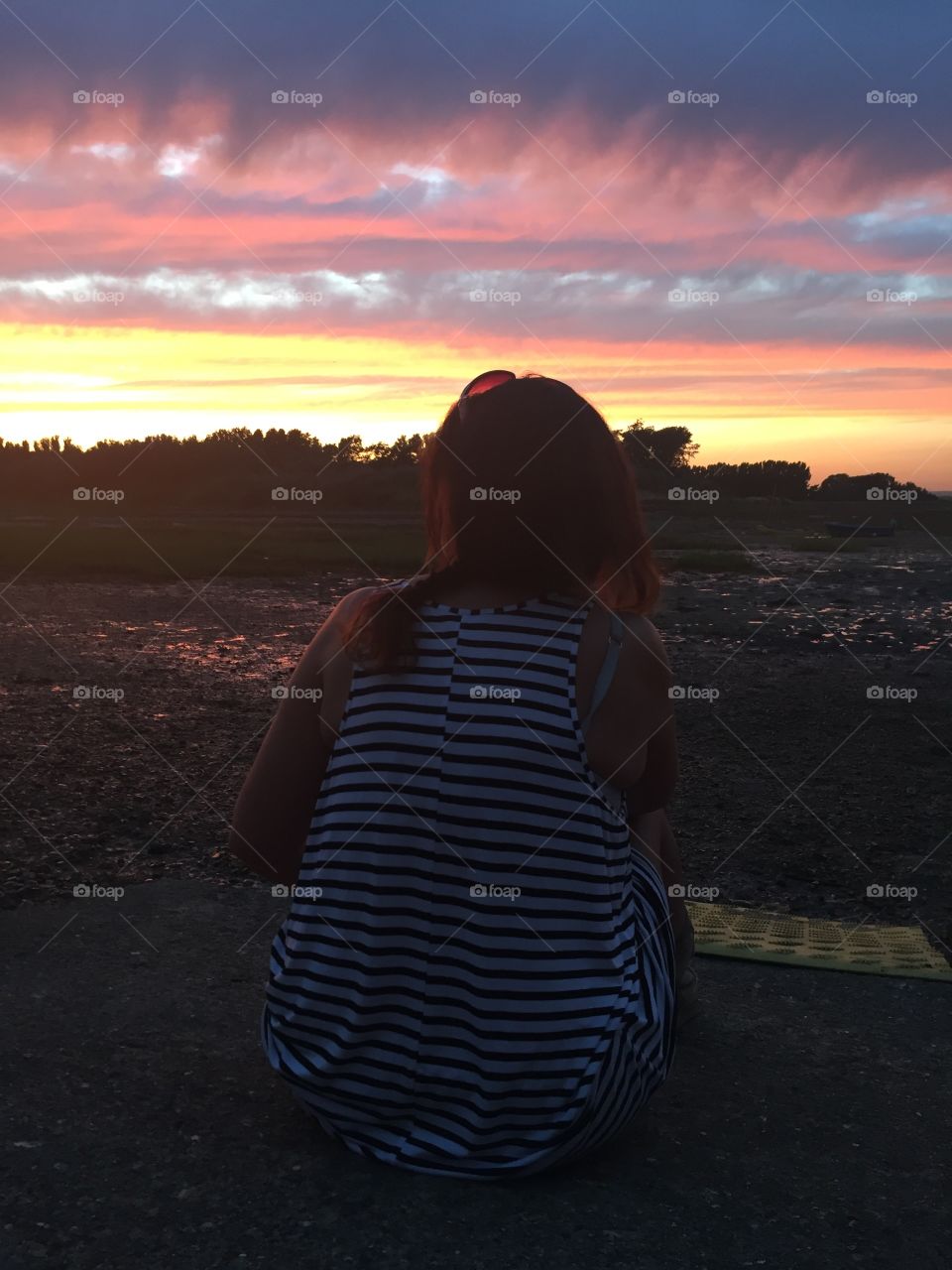 Woman looking at sunset 