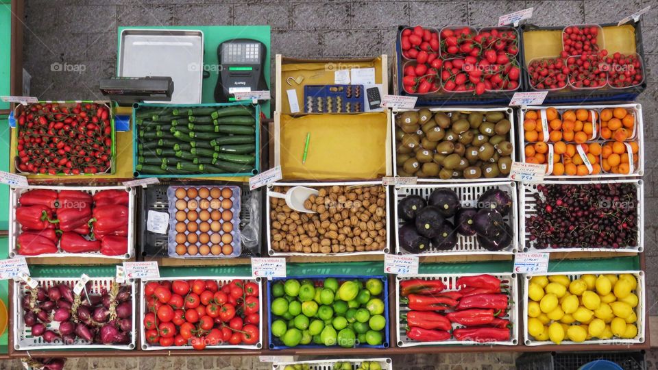 Colorful fruit and vegetable boxes photographed from above