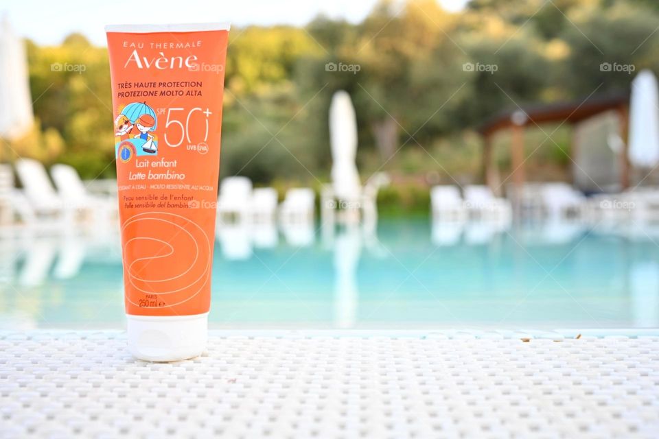 Avéne sunscreen by the pool