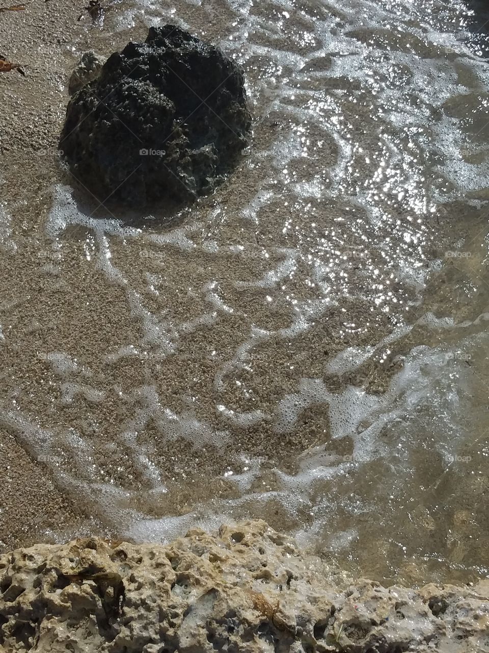 warm sand,clear water under a warm sun
