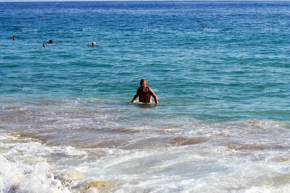 Man swimming in sea