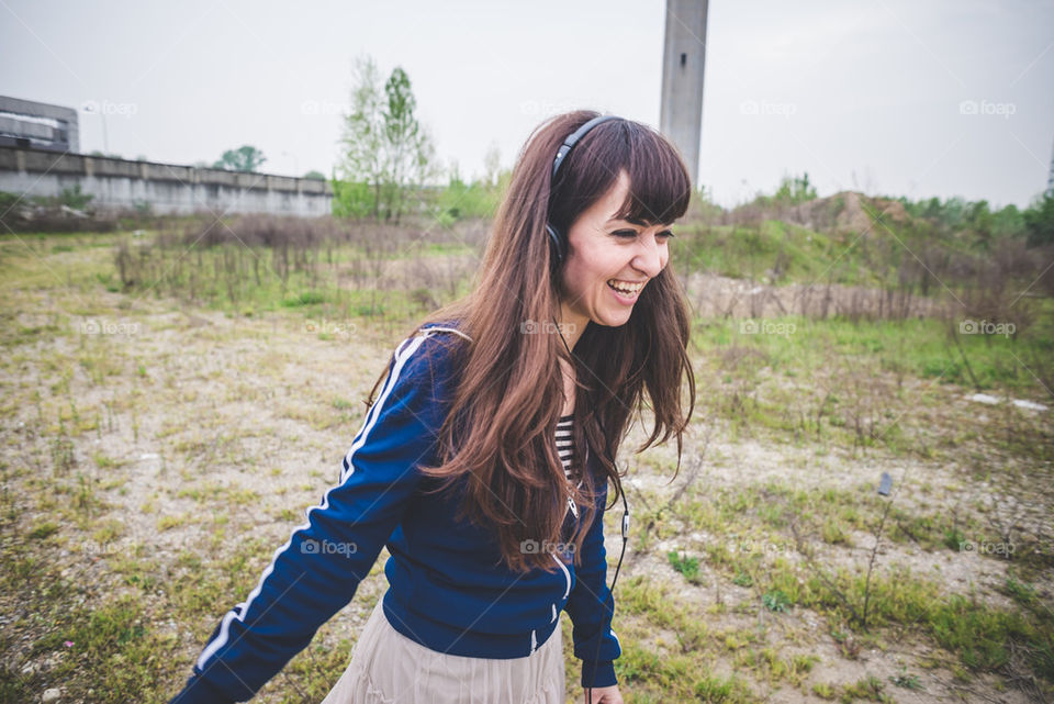 happy hipster woman listening to music