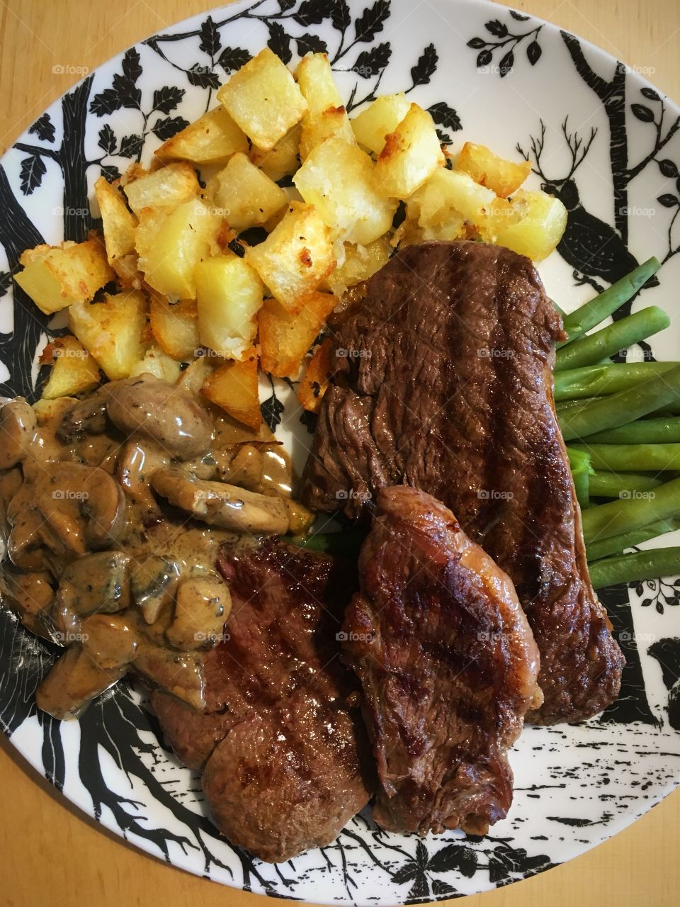 Home Steak and mini roasted garlic potatoes with mushroom sauce