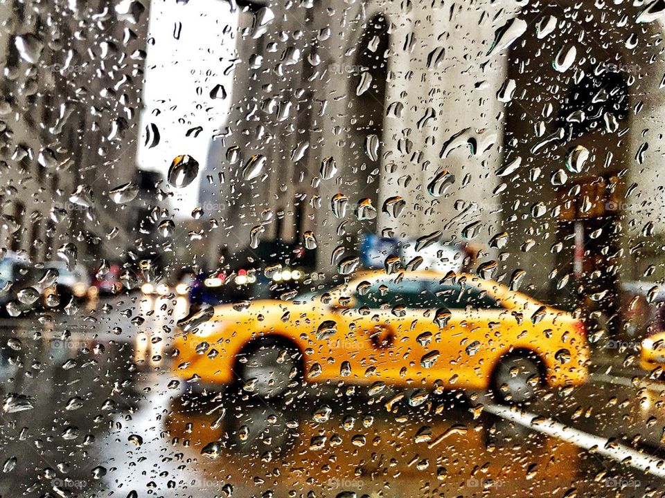 Yellow cab in the rain