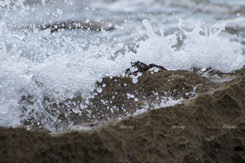 Wave hitting the rocks 