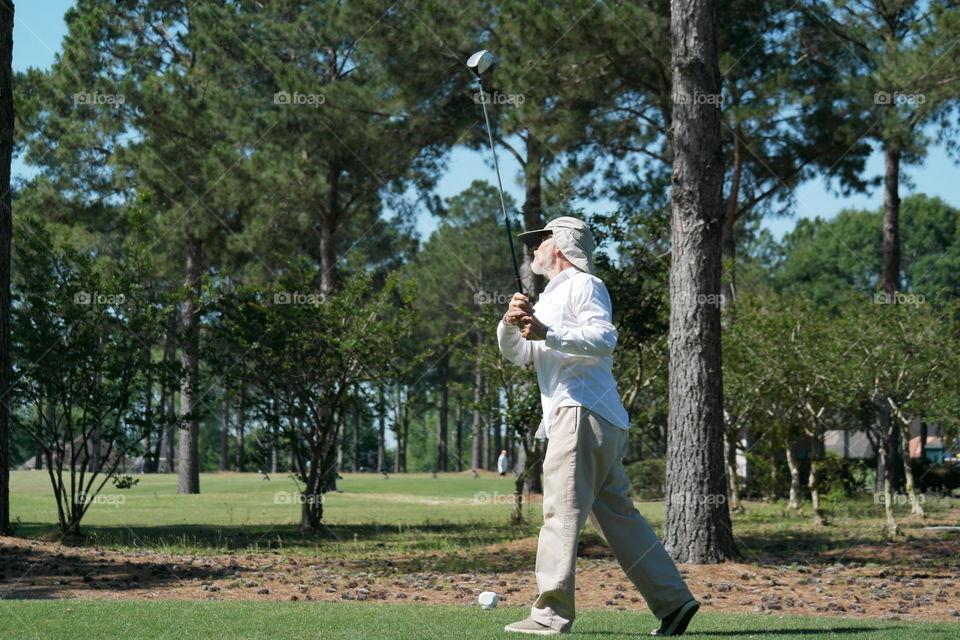 Man playing golf