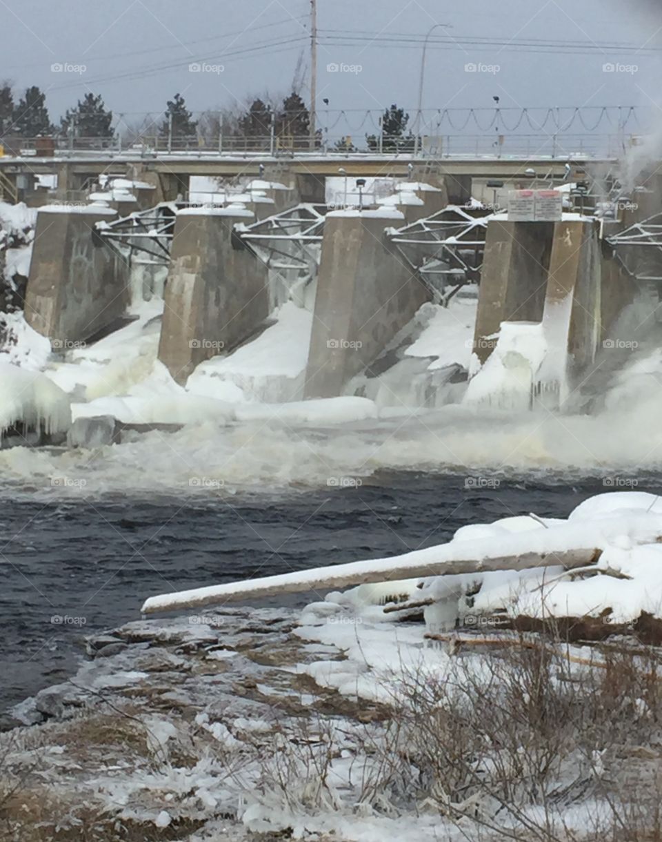 The dam in sturgeon falls some of the shots are frozen over the others are rushing water 