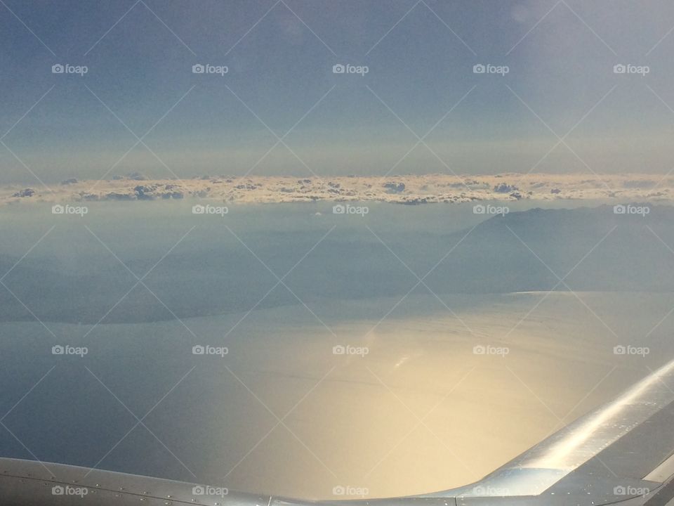 Plain sky sea flight