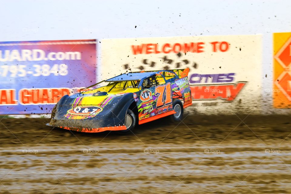 Dirt Late Model Race Car racing on the cushion Action Photo 