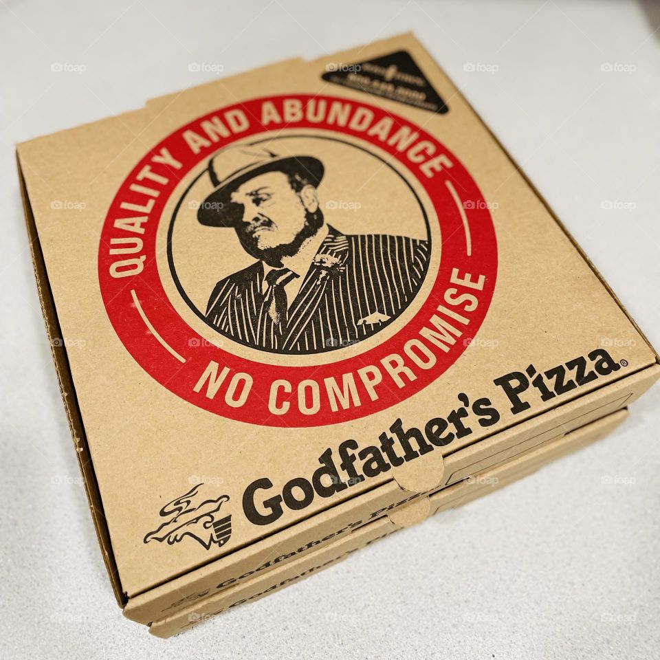 Eating Godfather’s Pizza, delicious local pizza place, eating fresh pizza, pizza with local ingredients 