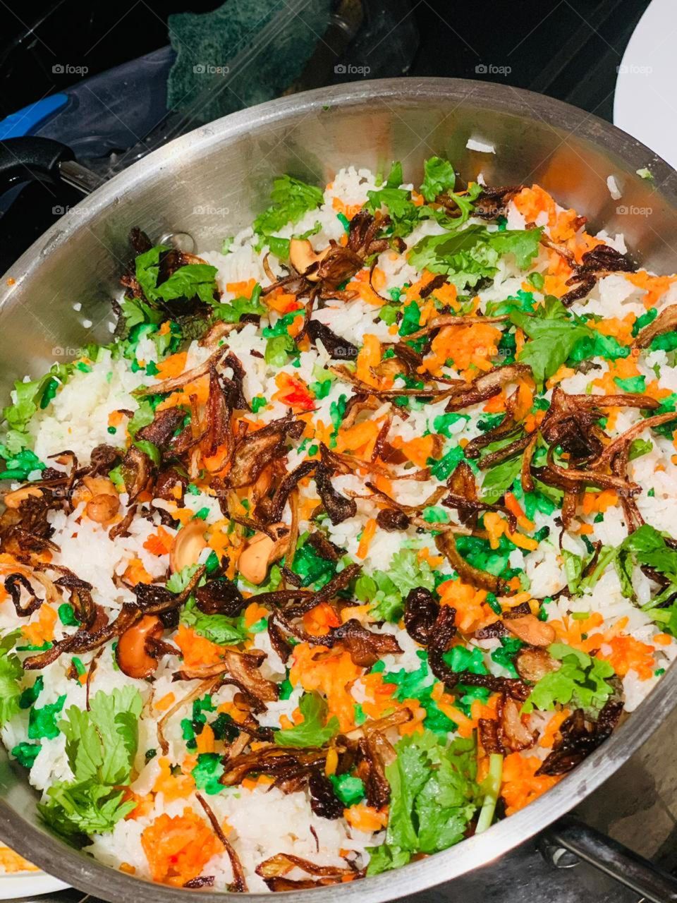 Biryani is a mixed rice dish originating among the Muslims of the Indian subcontinent. It is made with Indian spices, rice, and meat, and sometimes, in addition, eggs and/or vegetables such as potatoes in certain regional varieties.