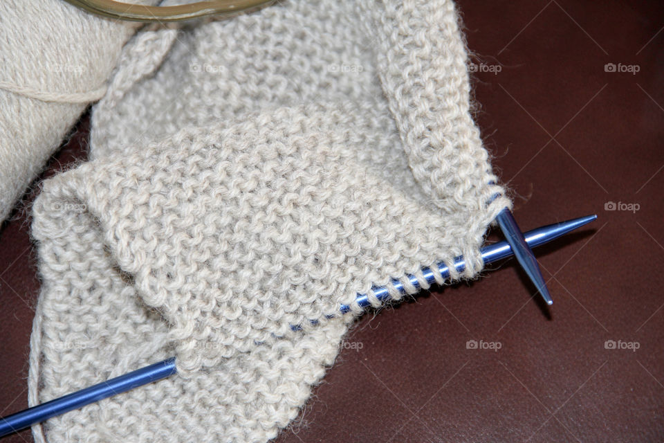 Knitting crocheting needles and gray yarn