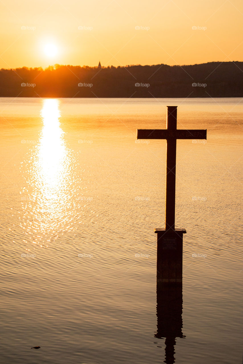 Close-up of cross on lake