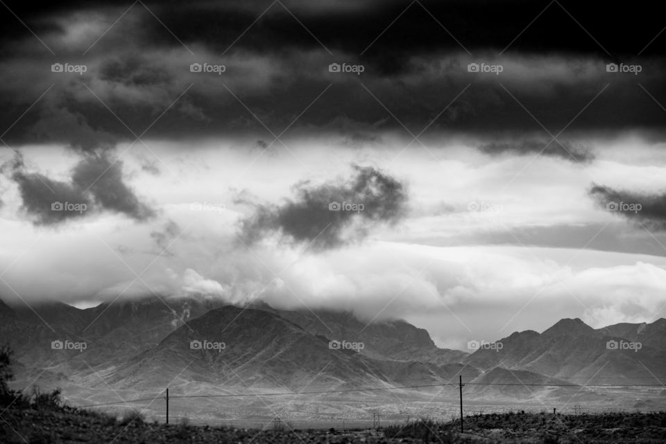 Mountains under grey cloud cover