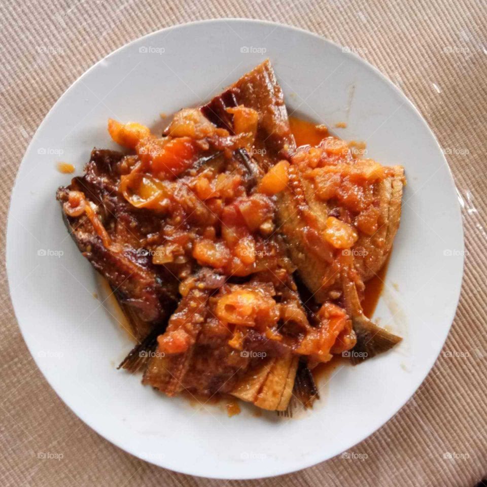 Dried salted fish in tomatoes, to go with steamed rice.