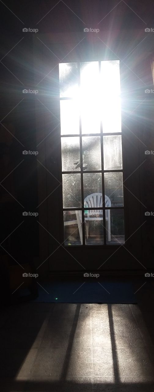 sunsets shining colorful light  throughout the room