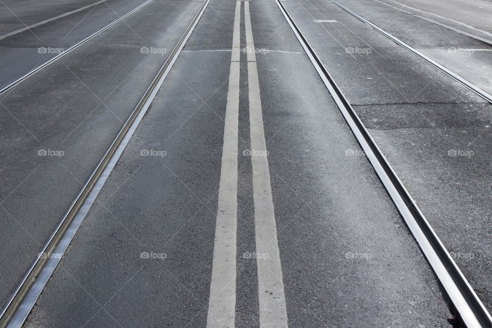 Symmetry, Asphalt street with lines and tram tracks 
