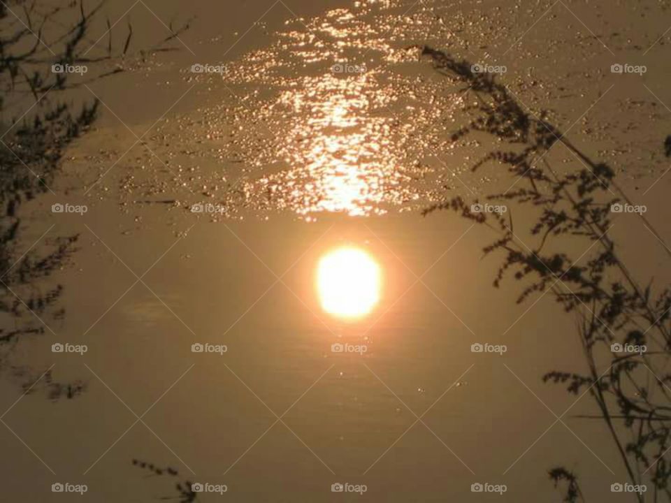 Sun image on water surface