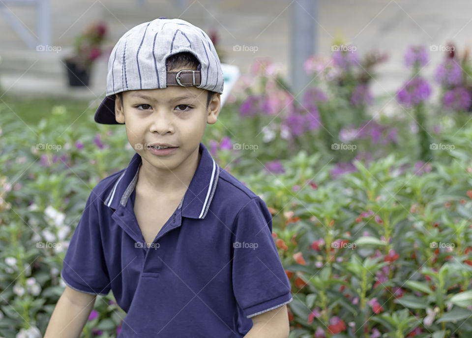 Portrait of Asean boy , laughing and smiling happily in the park.