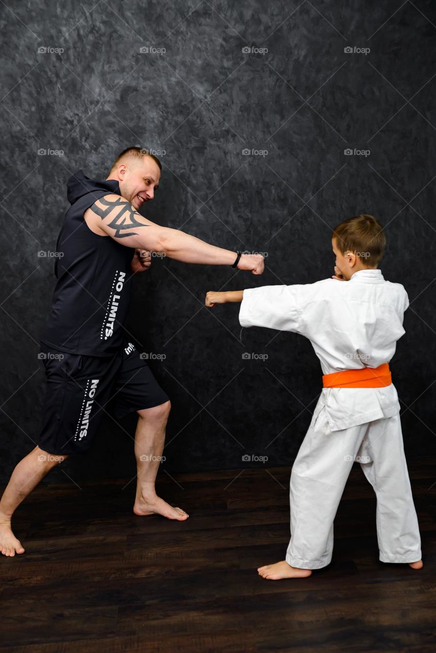 dad and son sports family, karate and boxing