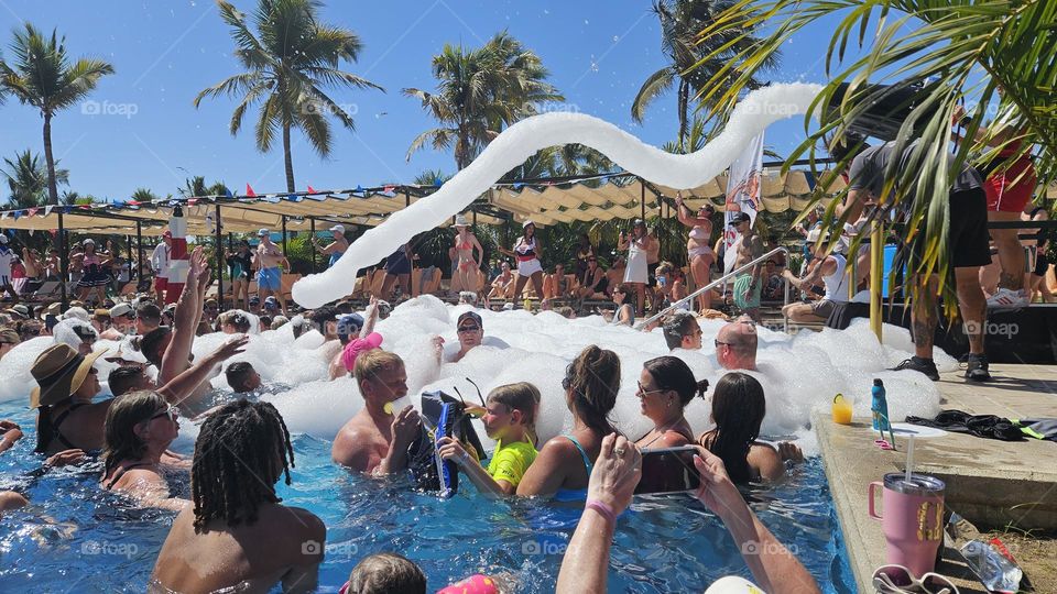 foam party bubbles in a pool. party, resort, all inclusive, Riu
