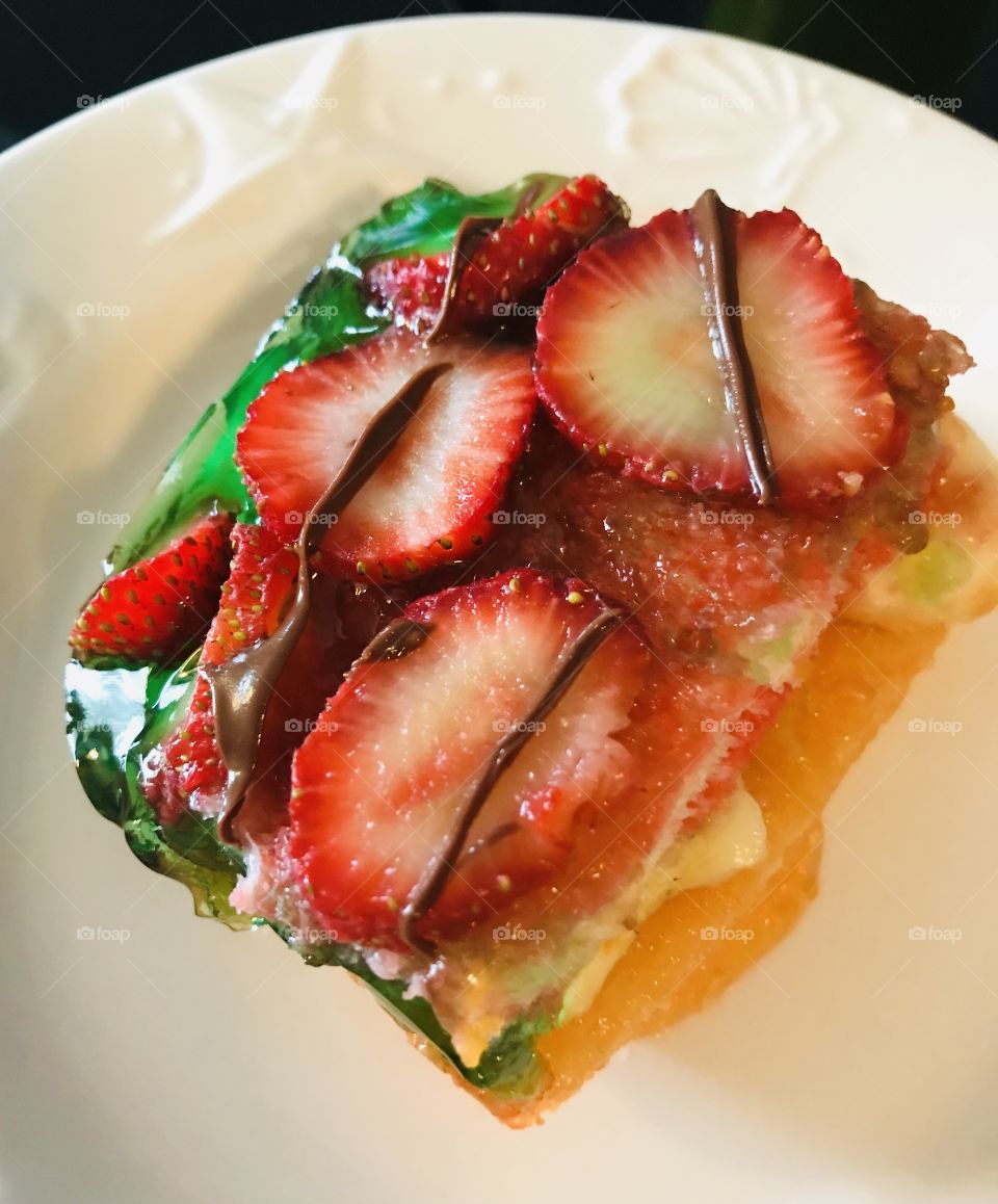 A piece of jello fruit cake