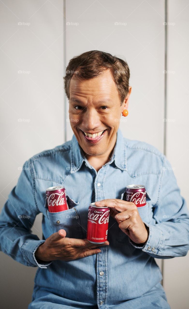 Man holding coke sodas