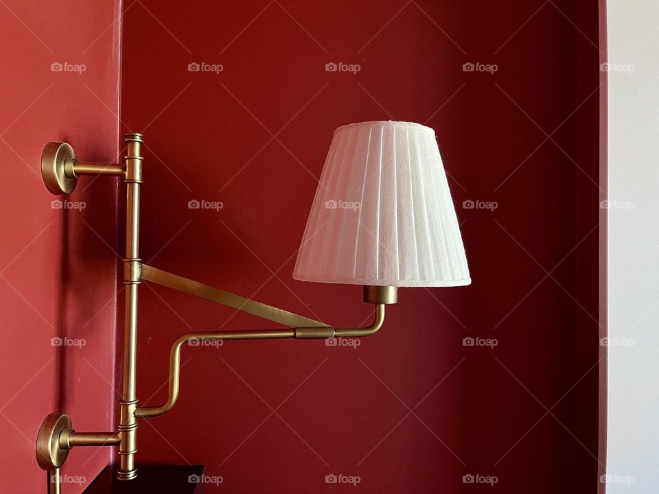 White lamp on red wall background 