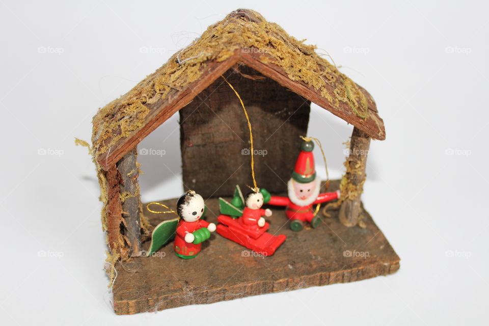 miniature wood House with Christmas figurines