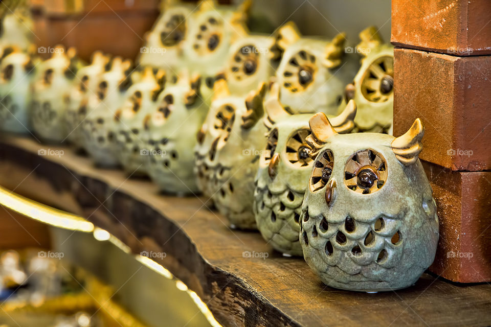 View of owl figurines on table for sale