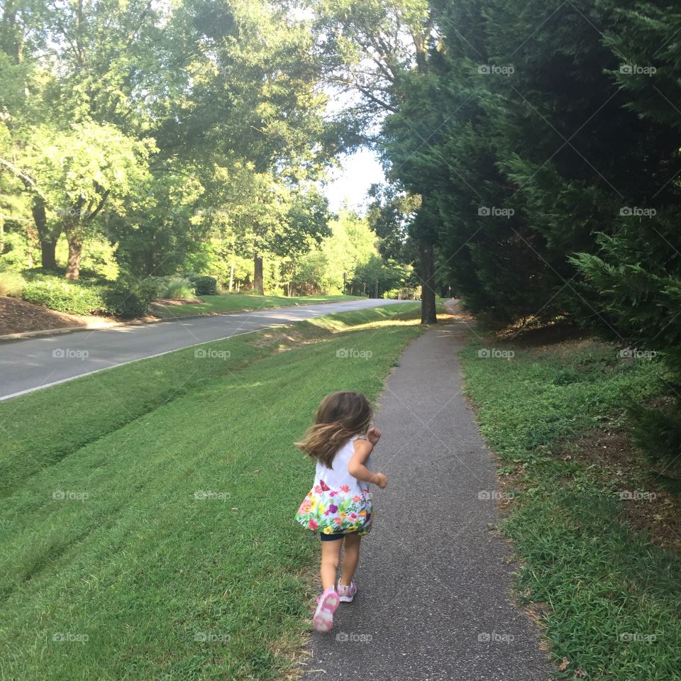 Girl running on trail