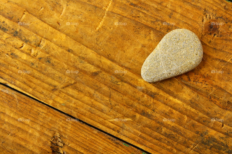 wooden table and a small stone