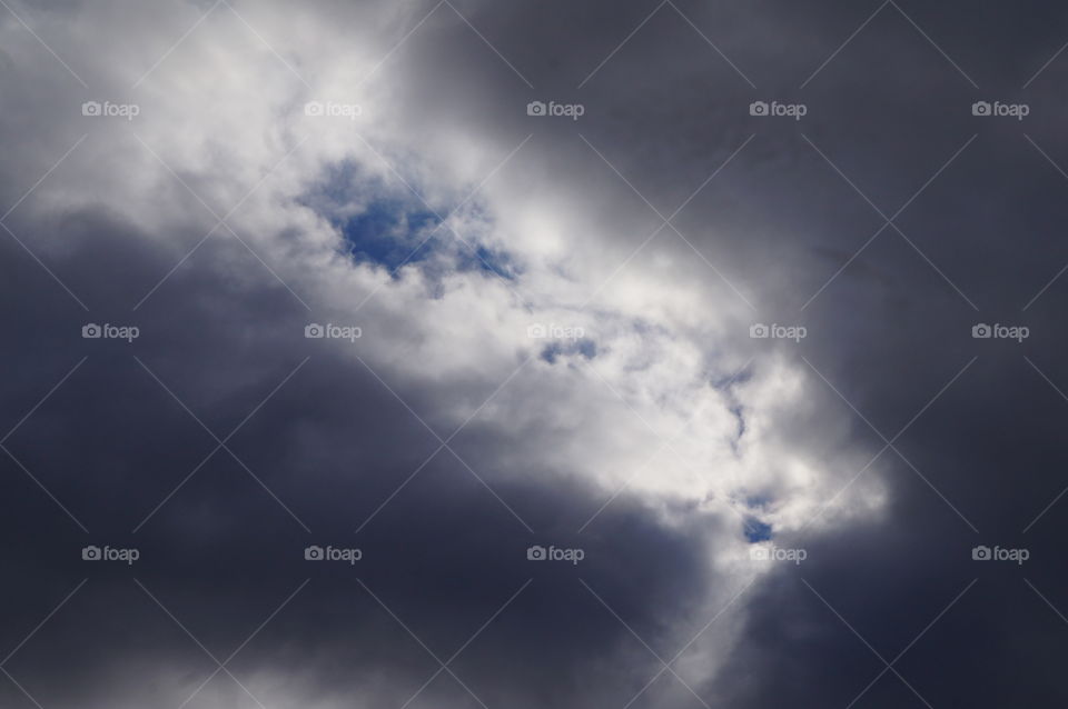 God's Peephole. Photo taken in Oklahoma.  Berry cloudy sky with one opening or peephole.