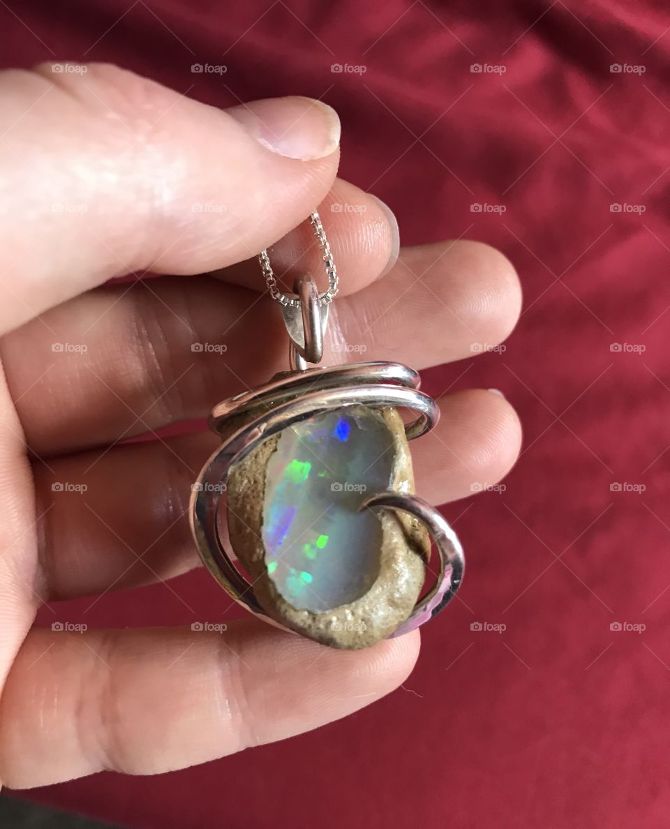 Hand cut, polished and wire wrapped Eithiopian opal pendant 