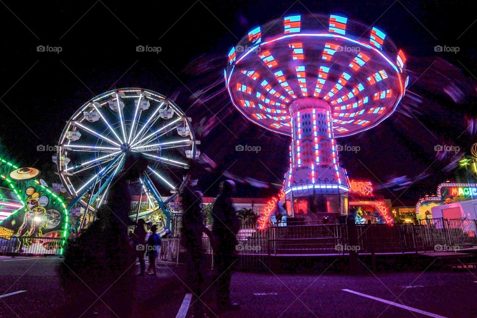 Vibrant carnival long exposure. Very colorful Ferris wheel
