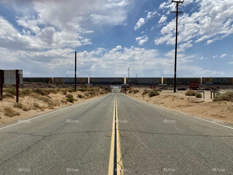 Freight train going across a bridge in the small town of North Edwards California 