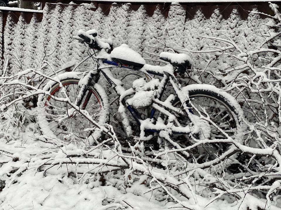 Vintage bike covered with snow 