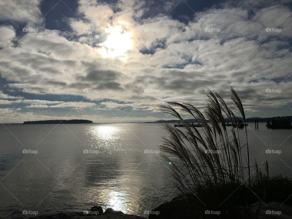 Scenic view of sea against cloudy sky