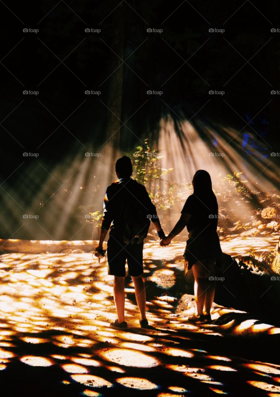 Holding hands walking in the lights