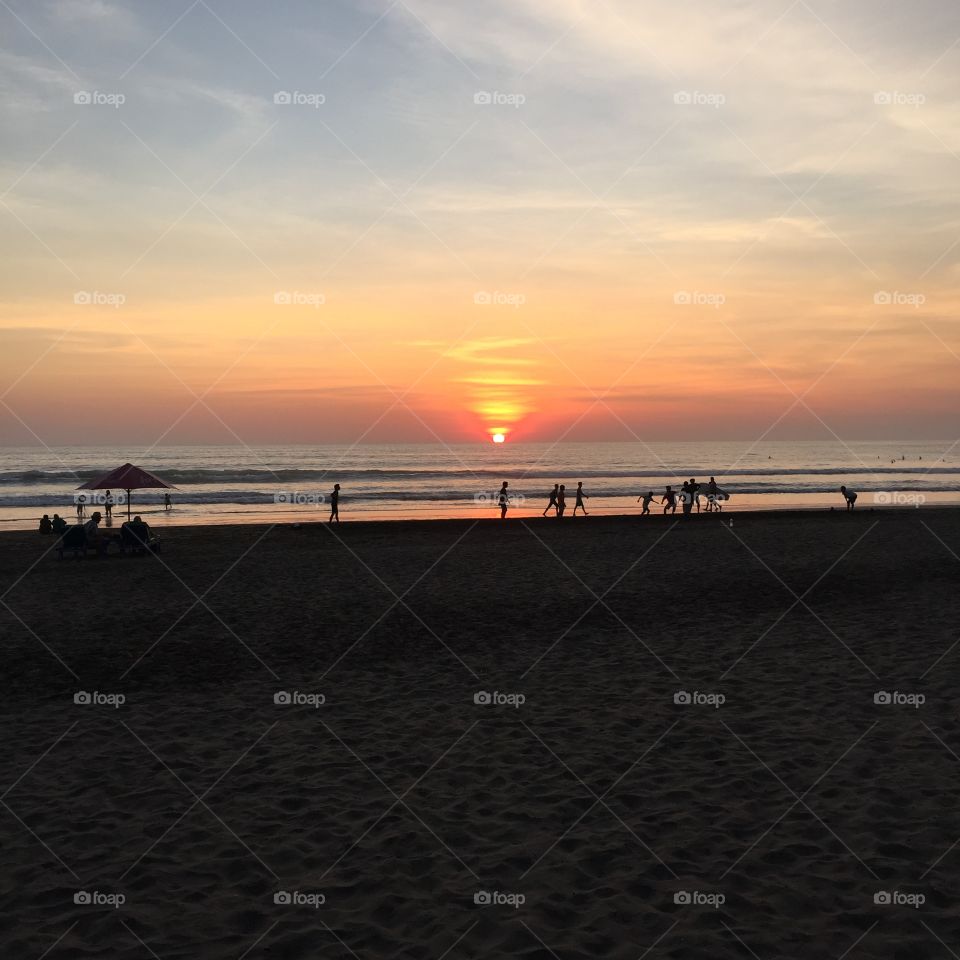 Soccer in the Sunset. Soccer on the beach as the sun goes down in Bali.