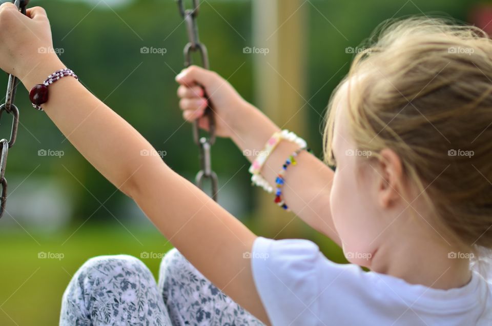 Young girl on a swing