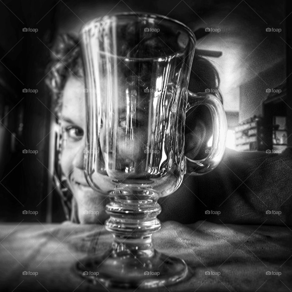 young man face reflection in glass