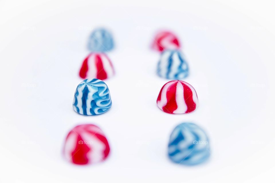 Blue and red candy on a white background